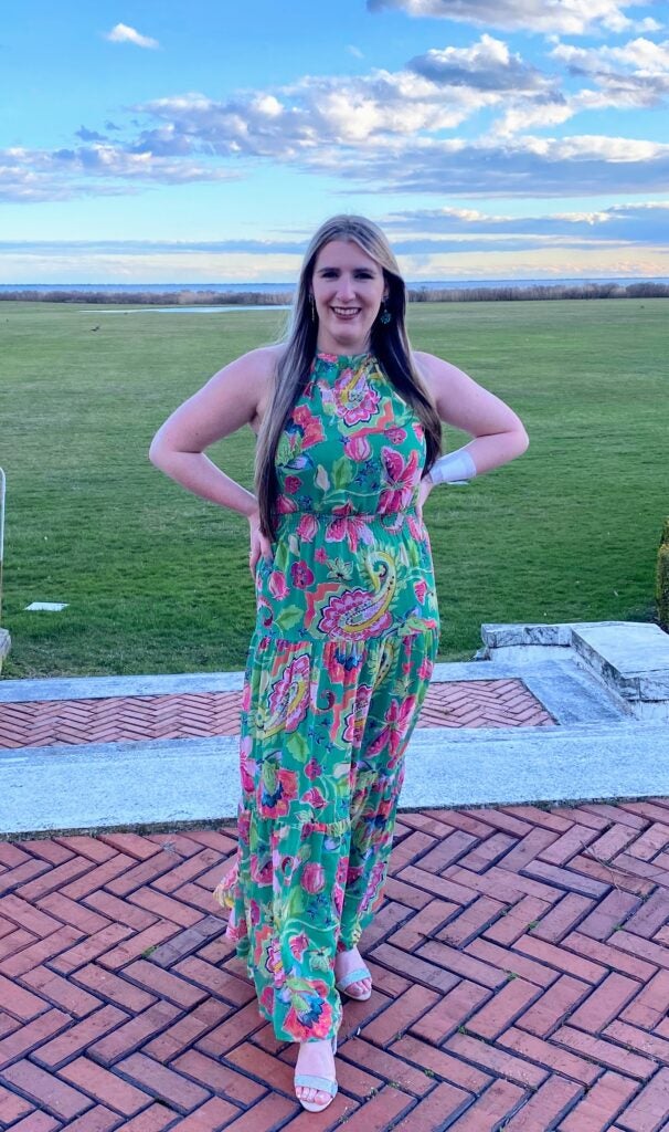 Picture of Sammie in a green floral dress.
