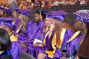 ECU College of Business sit and wait for commencement recognition ceremonies