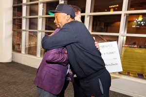 Dr. Mike Harris hugs Jamerus Payton during Pirate Entrepreneurship Challenge