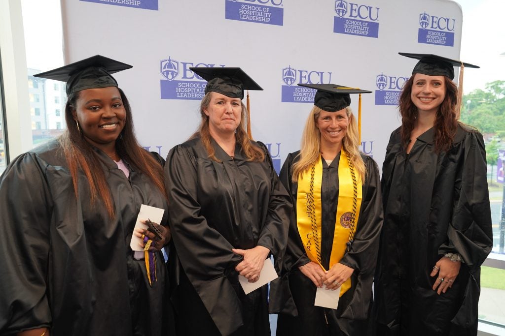 Photo of SHL masters graduates in their graduation robes