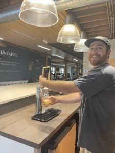 SHL Tanner Knoll pours a beer