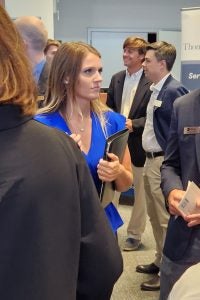Sarah Stewart speaks with accounting vendor at Meet the Firms