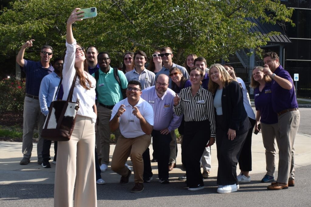 Second cohort of IMBAs outside business building. 