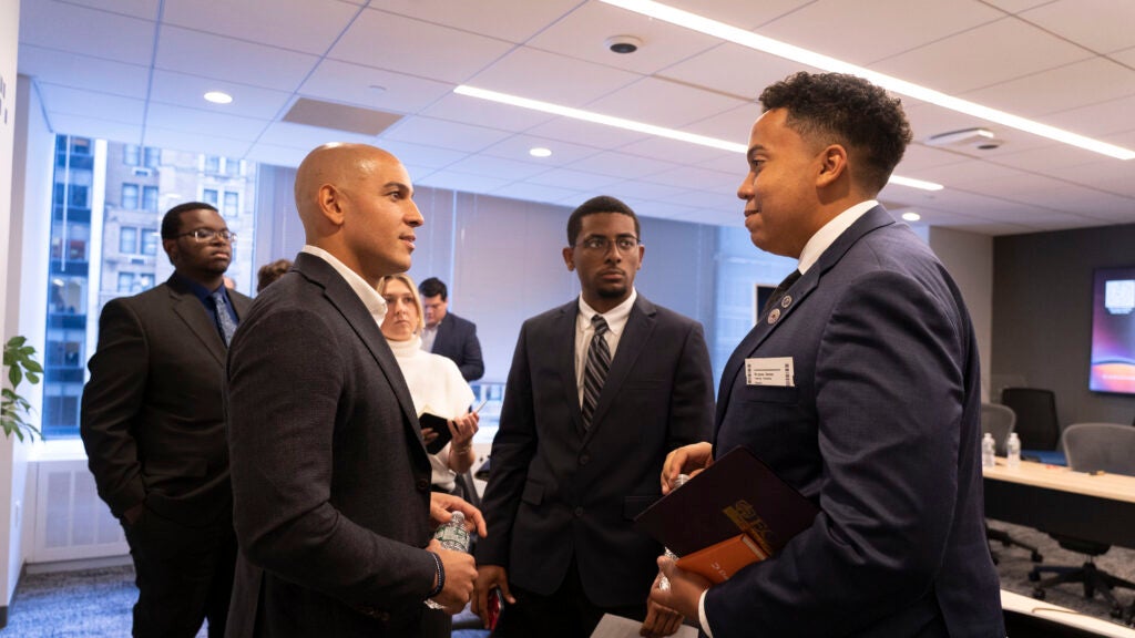 Taylor Dixon, SVP at Datasite, speaks to COB freshman and entrepreneurship student Roz Burgess in business offices of Datasite.