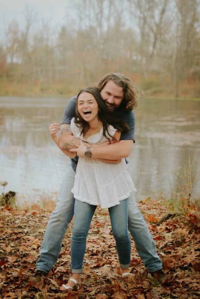 Brad Johns hugs a woman. 