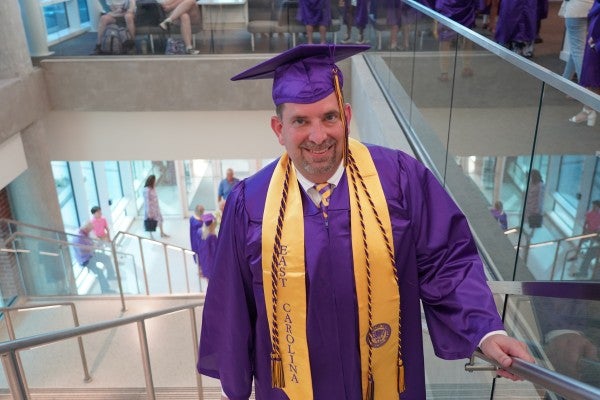 David Voelz in his graduation cap and gown. 